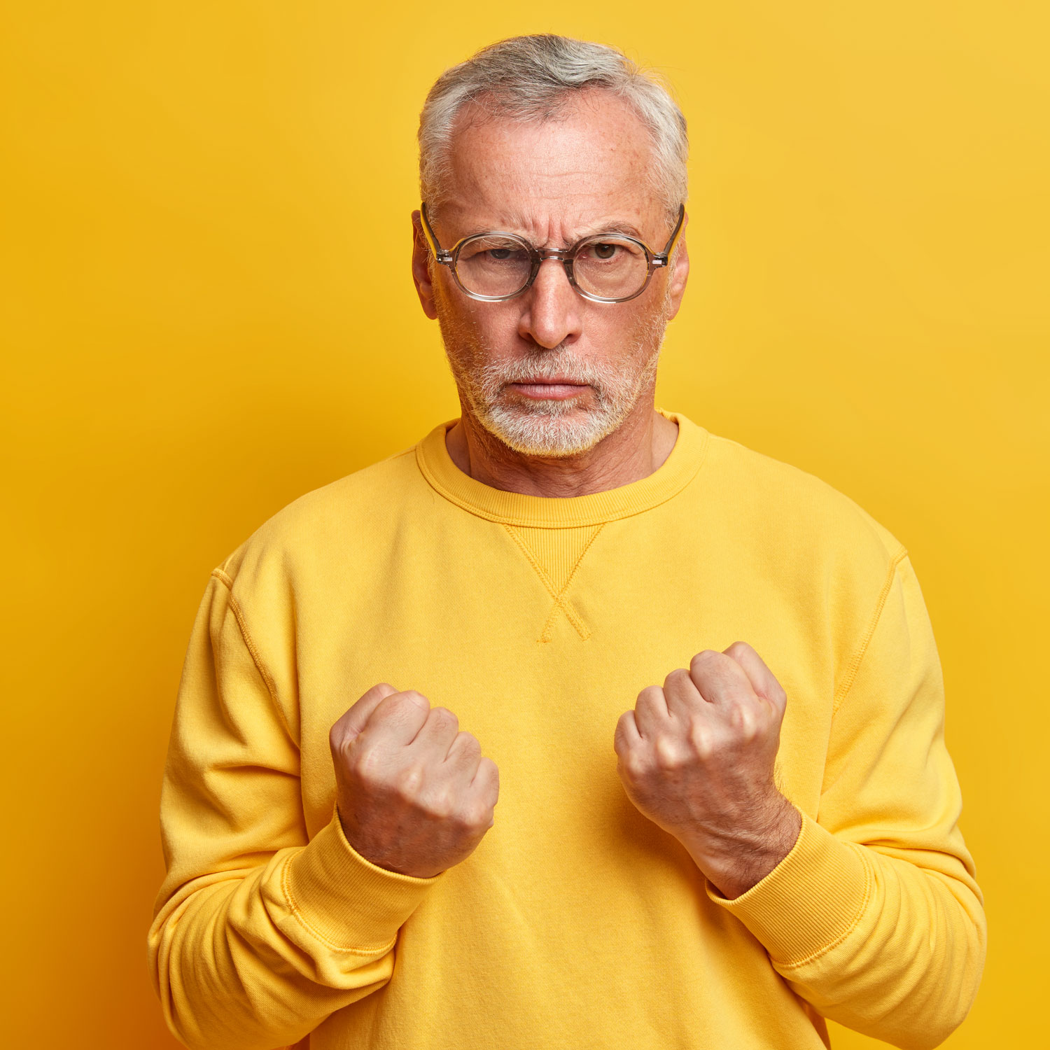 angry-aged-man-clenches-fists-as-going-to-defense-2021-08-31-09-12-22-utc.jpg